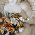 statue holding wedding flowers